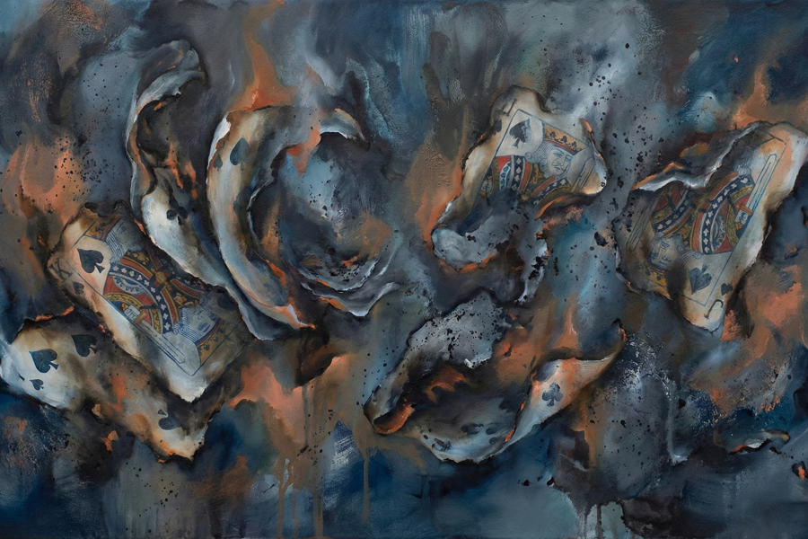 a burning house of cards